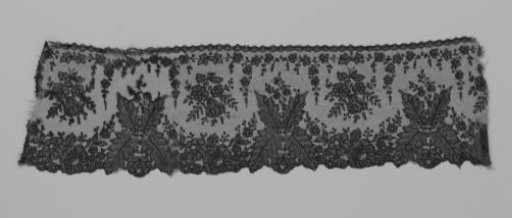 Japanese border strip of bobbin lace with ferns