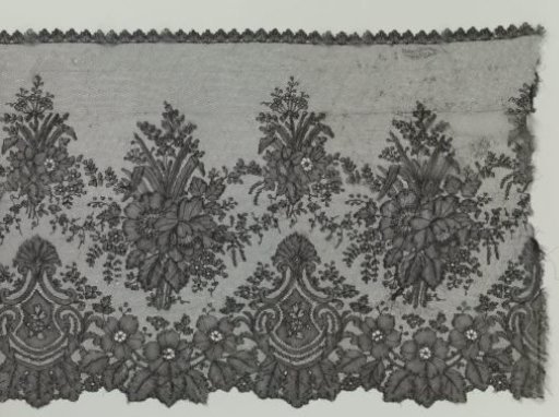 Strip of bobbin lace in Japanese style with shield-shaped medallions