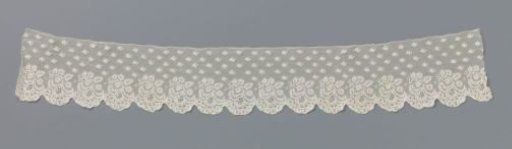 Strip of bobbin lace with hanging leaf branch