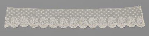 Strip of bobbin lace with hanging leaf branch