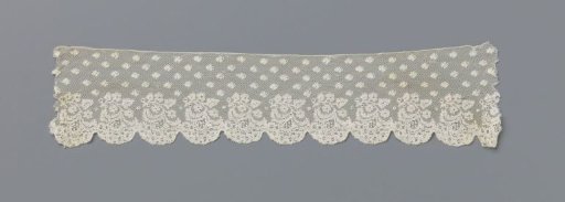 Strip of bobbin lace with hanging leaf branch