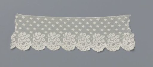 Strip of bobbin lace with hanging leaf branch