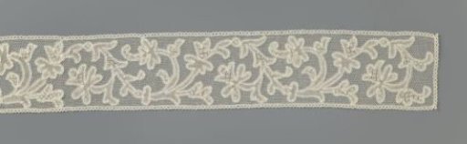 Strip of mixed lace with broad spiral vine