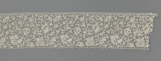 Strip of needle lace with a four-leaf clover