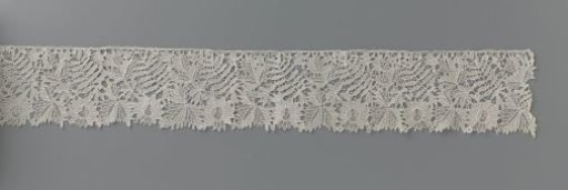 Strip of needle lace with incised leaf