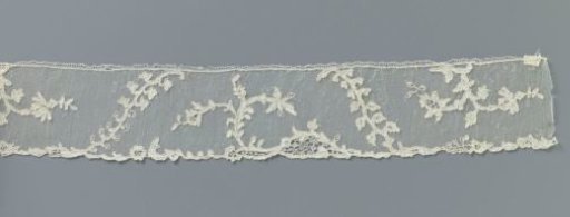 Strip of needle lace with diagonal sprigs