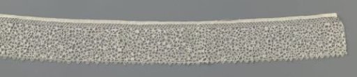 Strip of needle lace with serpentines