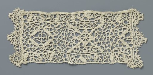 Strip of crocheted lace with reticella motifs