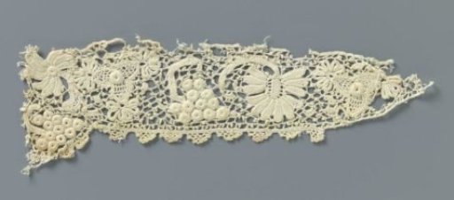 Strip of crocheted lace with flowers and grape cluster