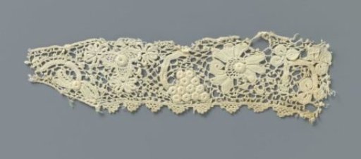 Strip of crocheted lace with flowers and grape cluster