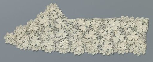 Strip of crocheted lace with flowers and a bunch of grapes