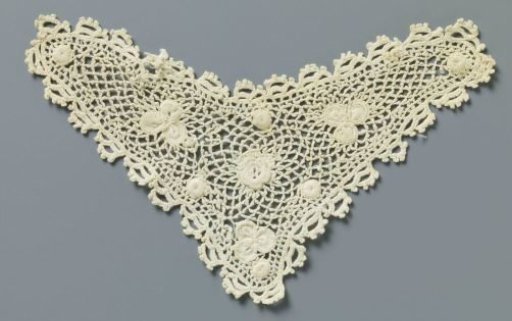 Insert of crocheted lace with rose and clover leaves