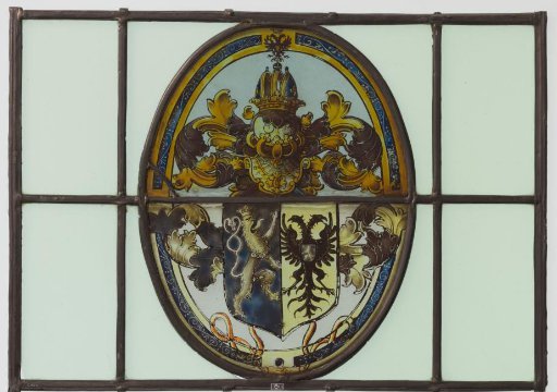 Pane with a coat of arms featuring a climbing lion and a two-headed bird