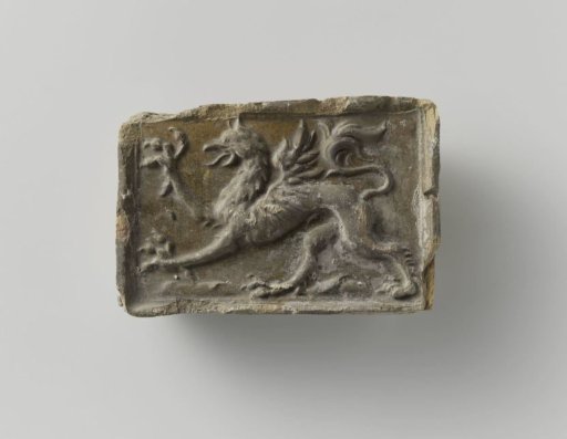 Fireplace, glazed, depicting a griffin