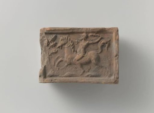 Fireplace with a depiction of a horseman on horseback