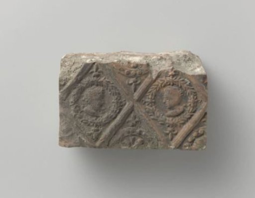 Fireplace with a depiction of two male heads in panes