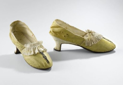 Lady's Shoe of Golden-Yellow Quilted Silk with Pleated Cream-Colored Silk Strip and Silver Lovers