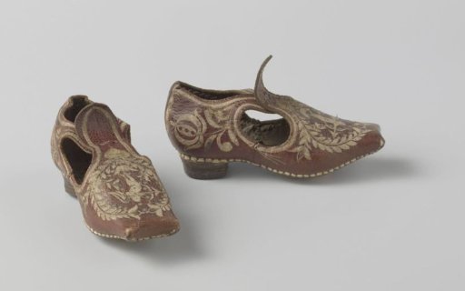 Shoe of red leather in miniature size