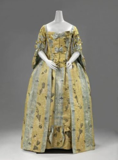Overjapon of grey-blue and yellow striped lampas, with woven bizarre patterns composed of vases with leaf and flower motifs and geometric figures brocaded with metal thread