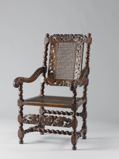 Armchair with caned seat; back splat and front rail openwork with acanthus scrolls, with a royal crown in the center of the front rail and upper rail
