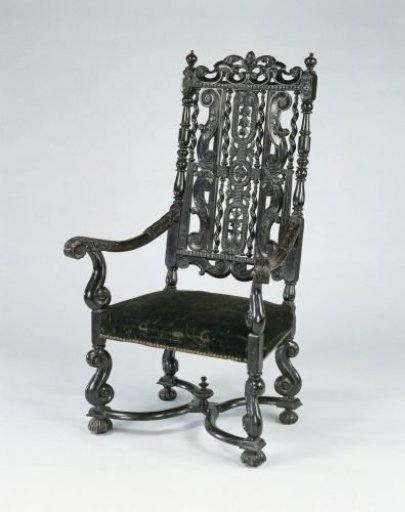 Armchair of black lacquered and stained walnut