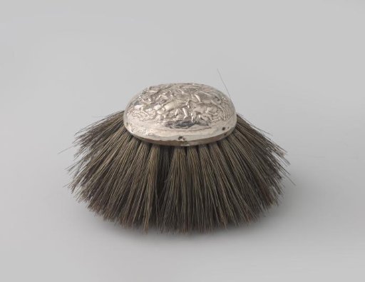 Brush decorated with chased cavalry combat