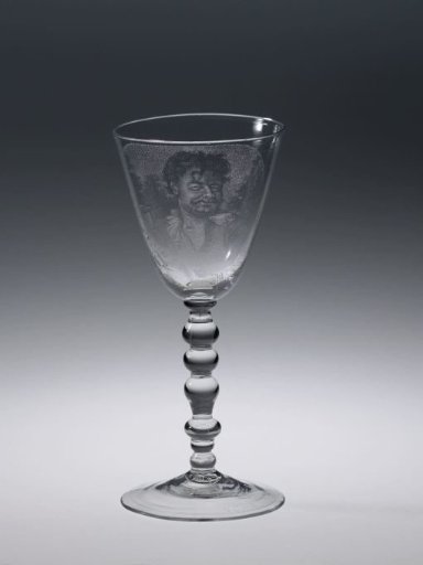 Chalice glass with a smiling man with birch branches