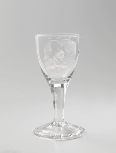 Wine glass with a representation of a man counting money
