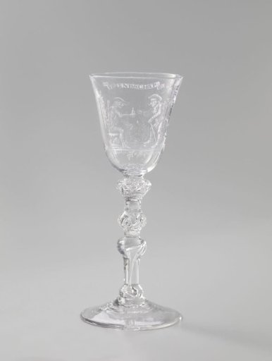 Wine glass with two drinking men