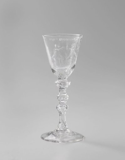 Wine glass with two drinking boys