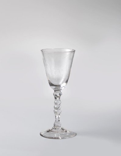 Chalice glass with a boy playing the flute and a girl with a mandolin