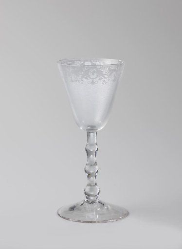 Chalice glass with an ornamental border