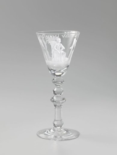 Wine glass with two seated women