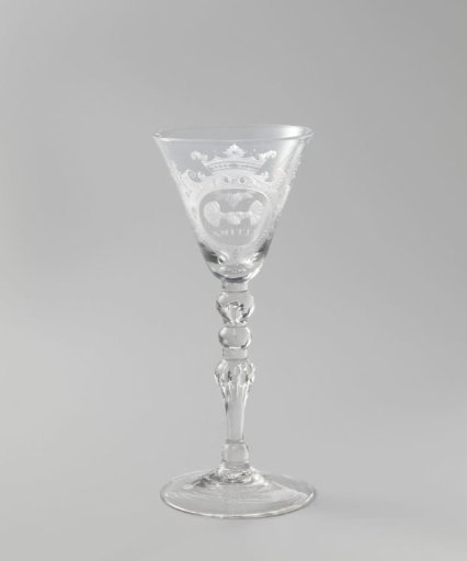 Wine glass with two clasped hands
