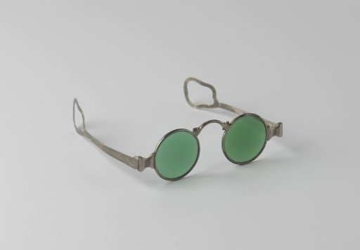 Spectacles with silver frame and round green lenses