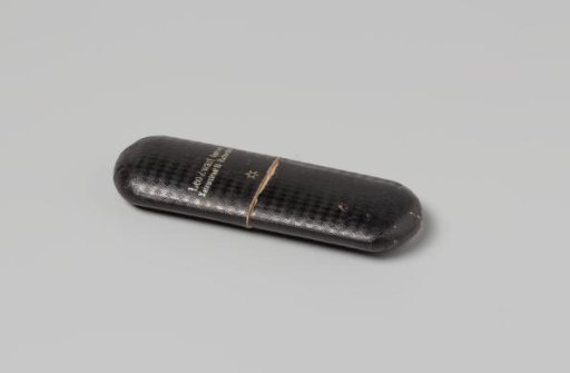 Spectacle case, elongated with rounded corners, covered with black checkered paper