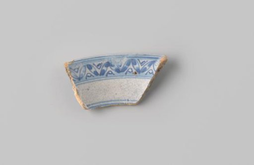 Sherd of reddish-firing earthenware, glazed white, with a border in blue on the front