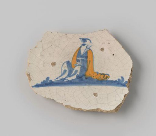Fragment of White-Fired Earthenware with a Ring Foot, Coated with White Glaze on Front and Back, Depicting a Seated Figure in Blue with a Yellow Mantle on the Front