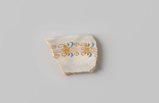 Fragment of White-Fired Earthenware, Coated with White Glaze with a Border of Orange and Blue Scrolls and Yellow Stripes in Blue