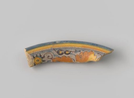 Fragment of White-Fired Earthenware, Coated with White Glaze with a Border and Floral Motifs in Orange, Yellow, Blue, and Brown