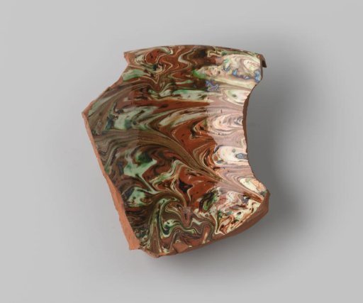 Fragment of red-firing earthenware, glazed on the inside and outside with marbled glaze in green, brown, beige and terra