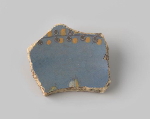 Fragment of reddish-fired earthenware, glazed blue on the upper side with a painting of a line with brown and yellow dots on either side