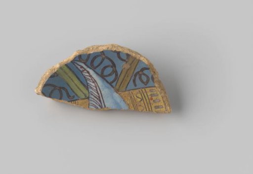 Fragment of reddish-fired earthenware, glazed blue on the upper side, with a portion of an unknown representation depicted in yellow, orange, white and brown