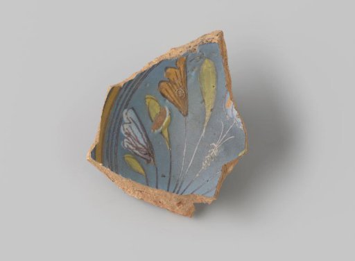 Fragment of reddish-fired earthenware, with a foot ring, glazed blue on the front, with a bouquet of flowers in yellow, white, blue, green and orange, stripes around it