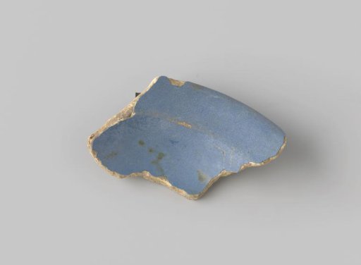 Fragment of white-fired earthenware, glazed blue on the front