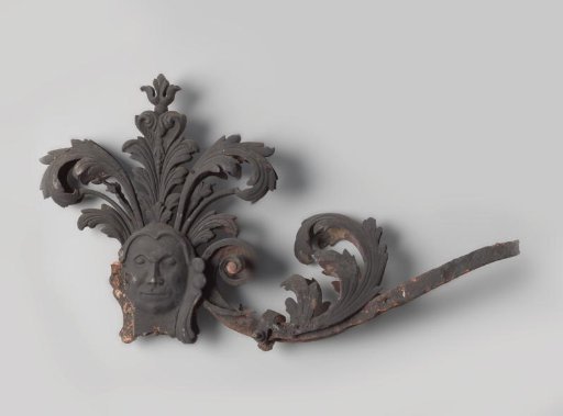 Ornament with head and acanthus leaves