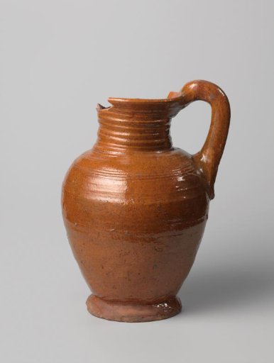 Jug with handle, with lead glaze on red-brown fired clay
