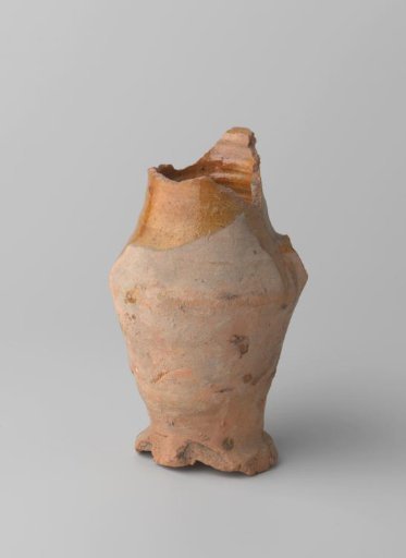 Pitcher of red-baked earthenware, glazed on the inside and partly on the outside, with damaged rim, foot and handle