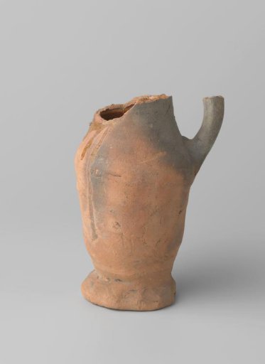 Pitcher of red-baked earthenware, glazed on the inside and partly on the outside, with damaged rim, foot and handle