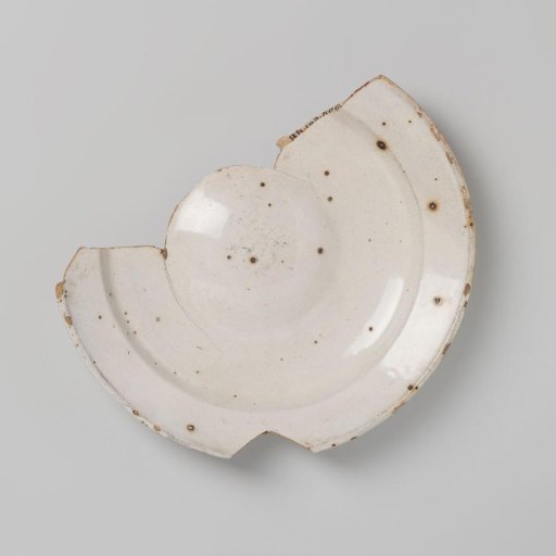 Earthenware plate, entirely covered with white tin glaze, damaged
